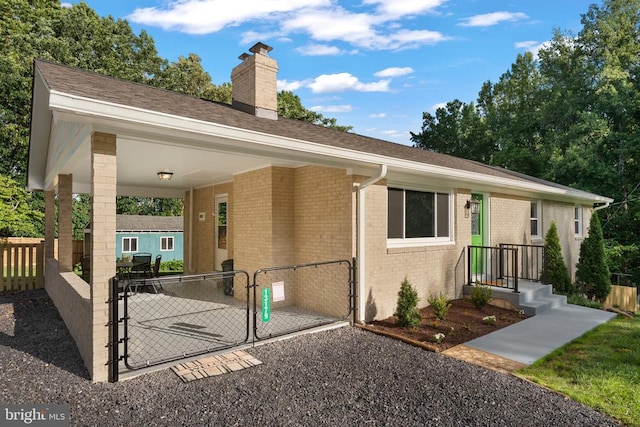 13179 Scotts Mill Rd, Culpeper, VA 22701 - view of front of property with a chimney, a gate, brick siding, and a shingled roof