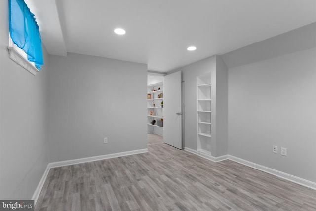 13179 Scotts Mill Rd, Culpeper, VA 22701 - empty room featuring wood finished floors, recessed lighting, baseboards, and built in shelves