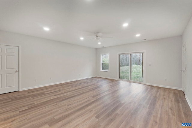 unfurnished room with ceiling fan, baseboards, light wood finished floors, and recessed lighting