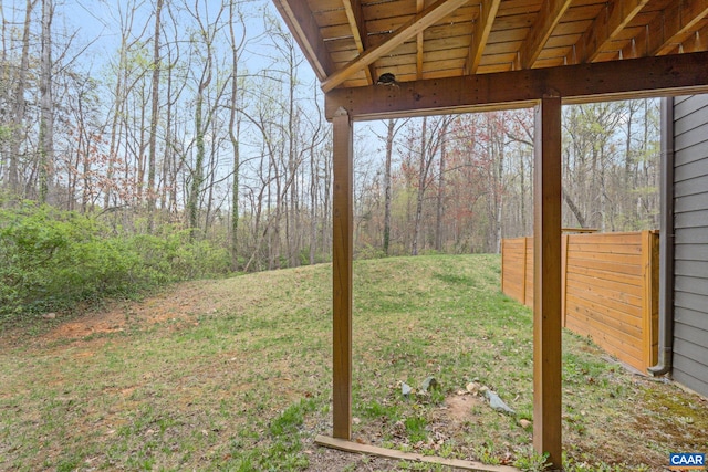 view of yard with a view of trees