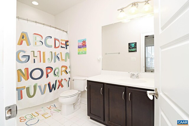 bathroom with vanity, toilet, and tile patterned floors