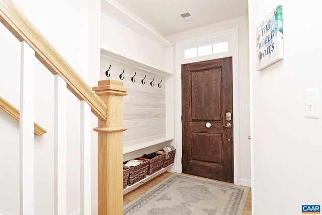mudroom with wood finished floors