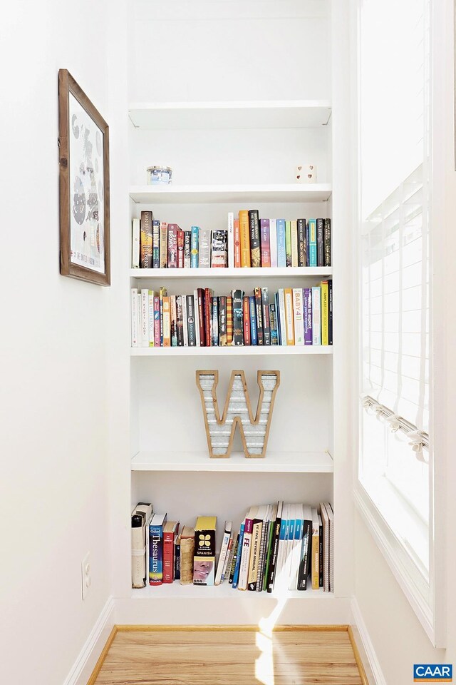 room details featuring baseboards and wood finished floors