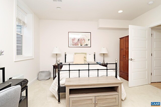 bedroom featuring light colored carpet, baseboards, visible vents, and recessed lighting