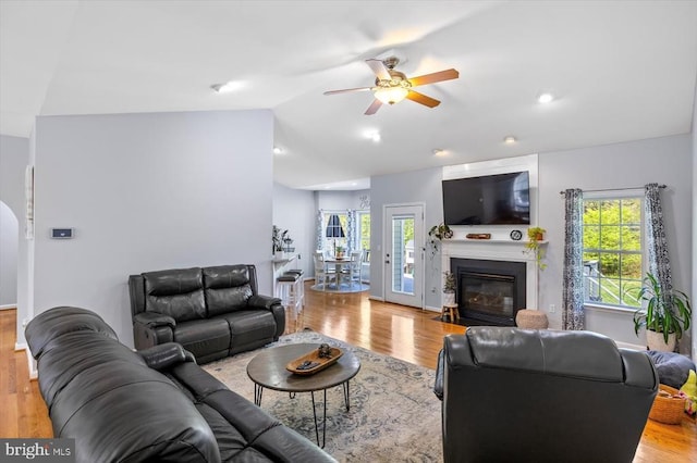 279 Carriage Ln, Madison, VA 22727 - living room with a ceiling fan, lofted ceiling, wood finished floors, and a fireplace with flush hearth