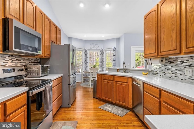 279 Carriage Ln, Madison, VA 22727 - kitchen with appliances with stainless steel finishes, light wood-style floors, backsplash, light countertops, and recessed lighting