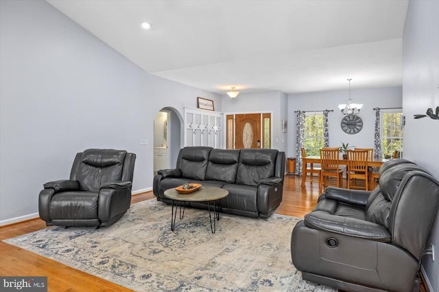 279 Carriage Ln, Madison, VA 22727 - living room featuring a chandelier, arched walkways, wood finished floors, and recessed lighting