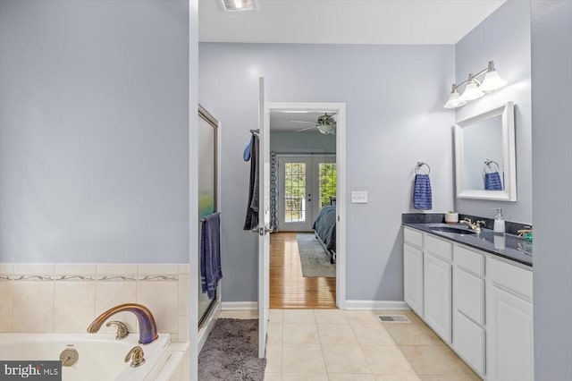 279 Carriage Ln, Madison, VA 22727 - ensuite bathroom with french doors, vanity, tile patterned floors, a garden tub, and ceiling fan