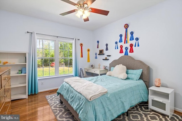 279 Carriage Ln, Madison, VA 22727 - bedroom with wood finished floors, baseboards, and a ceiling fan