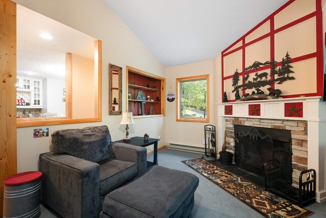 living room with vaulted ceiling, baseboard heating, a stone fireplace, and carpet floors