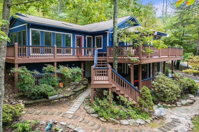 rear view of house featuring a deck