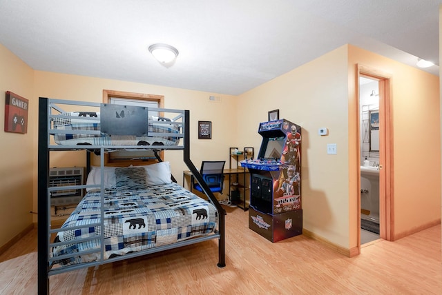 bedroom with hardwood / wood-style flooring