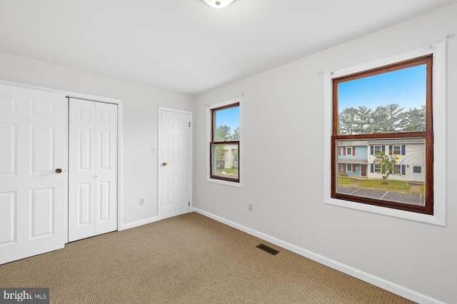 5143 Cottonwood Ct, Fredericksburg, VA 22407 - unfurnished bedroom with baseboards, carpet flooring, and a closet