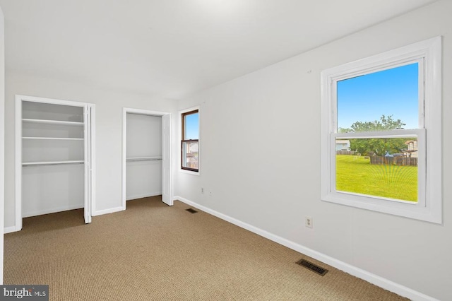 5143 Cottonwood Ct, Fredericksburg, VA 22407 - unfurnished bedroom featuring carpet floors, multiple closets, and baseboards