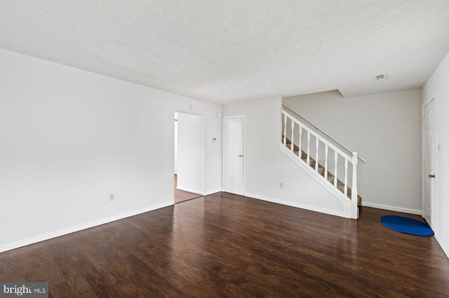 5143 Cottonwood Ct, Fredericksburg, VA 22407 - spare room with a textured ceiling, stairway, wood finished floors, and baseboards