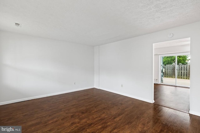 5143 Cottonwood Ct, Fredericksburg, VA 22407 - unfurnished room featuring dark wood finished floors, a textured ceiling, and baseboards