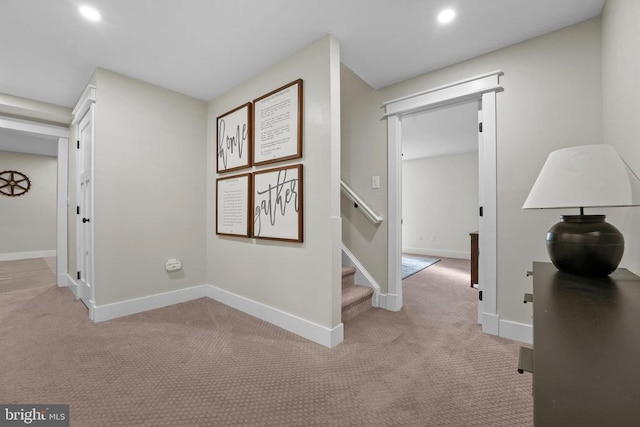 7345 Iron Bit Dr, Warrenton, VA 20186 - hallway with light carpet, recessed lighting, baseboards, and stairs