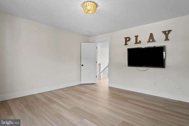 7345 Iron Bit Dr, Warrenton, VA 20186 - unfurnished living room with light wood finished floors and baseboards