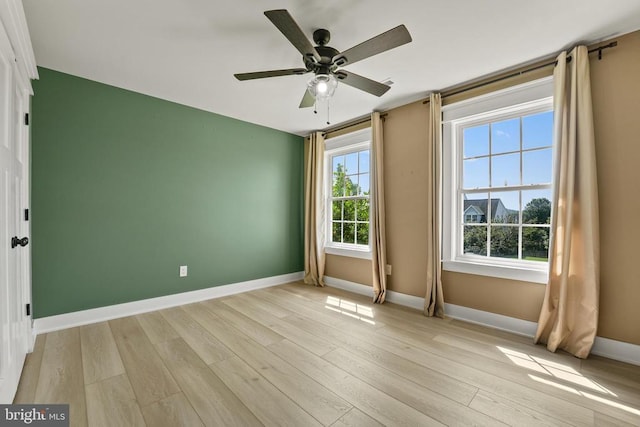 7345 Iron Bit Dr, Warrenton, VA 20186 - spare room with light wood-type flooring, a ceiling fan, and baseboards