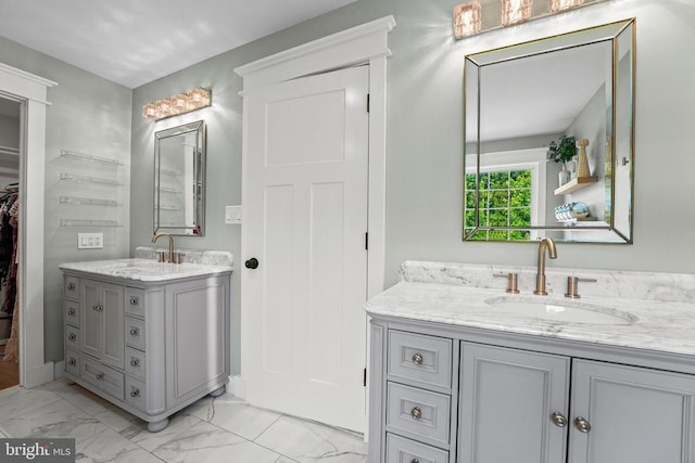 7345 Iron Bit Dr, Warrenton, VA 20186 - full bathroom with two vanities, marble finish floors, and a spacious closet