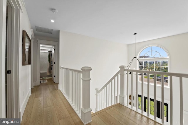7345 Iron Bit Dr, Warrenton, VA 20186 - hall featuring an upstairs landing, wood finished floors, recessed lighting, and baseboards