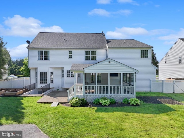 7345 Iron Bit Dr, Warrenton, VA 20186 - back of property with a sunroom, a gate, and roof with shingles