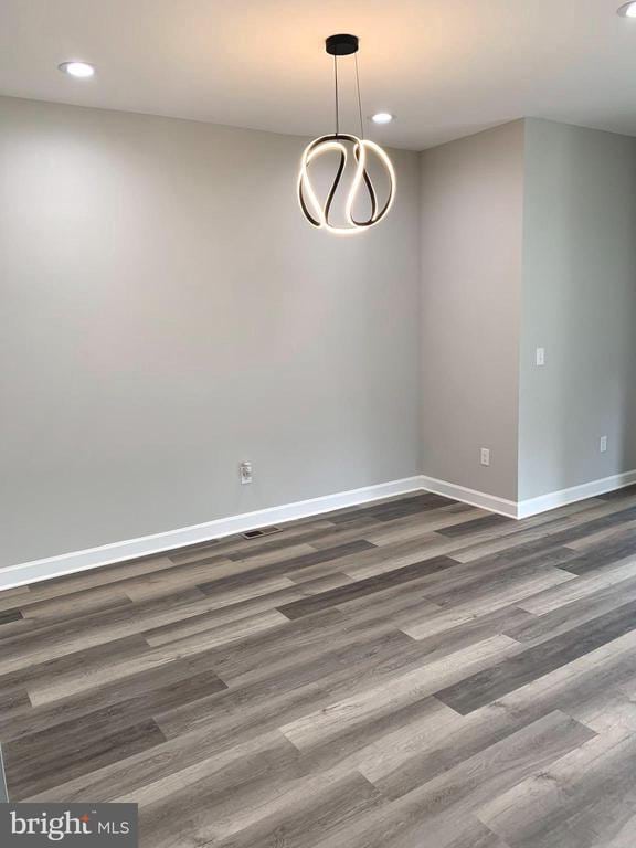 15477 Norman Rd, Culpeper, VA 22701 - spare room with dark wood-style floors, baseboards, recessed lighting, and a chandelier