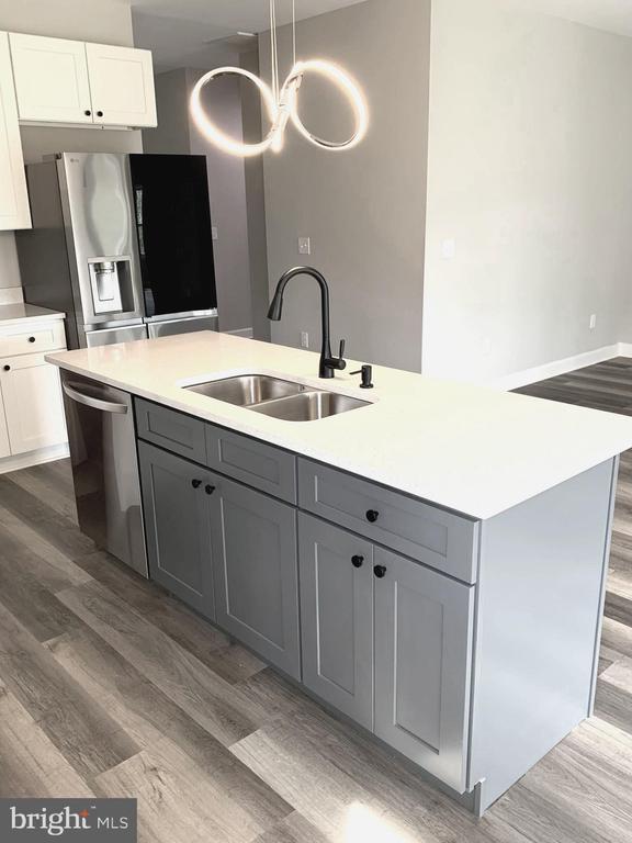 15477 Norman Rd, Culpeper, VA 22701 - kitchen with a sink, appliances with stainless steel finishes, dark wood-style floors, and gray cabinets