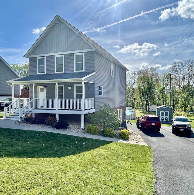 7 Rolla Mill Rd, Verona, VA 24482 - view of front of house with a porch, a front yard, a storage unit, driveway, and an outdoor structure