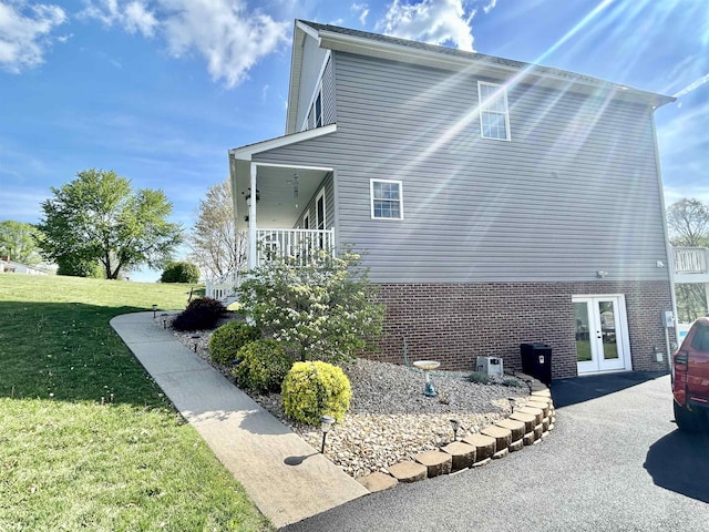 7 Rolla Mill Rd, Verona, VA 24482 - view of side of property with french doors, brick siding, and a lawn