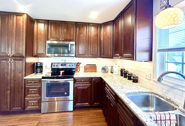 7 Rolla Mill Rd, Verona, VA 24482 - kitchen featuring appliances with stainless steel finishes, a sink, backsplash, wood finished floors, and light stone counters