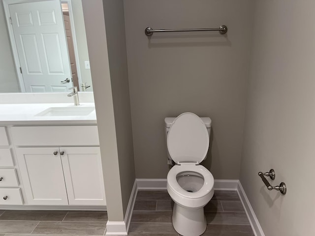 79 Meriwether Cir, Stuarts Draft, VA 24477 - bathroom featuring toilet, vanity, baseboards, and wood finished floors