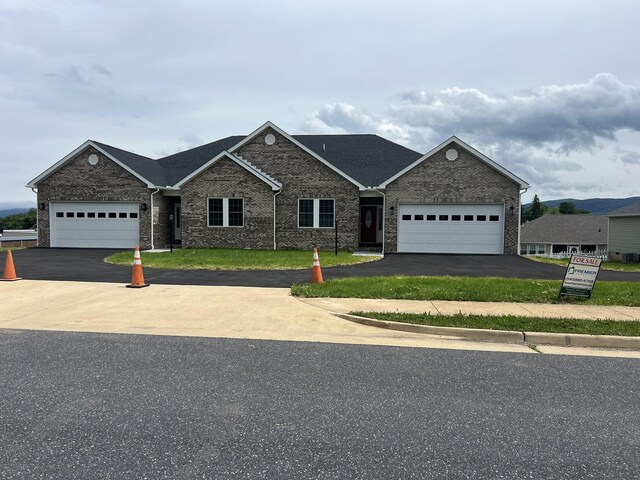 79 Meriwether Cir, Stuarts Draft, VA 24477 - view of front facade with asphalt driveway, brick siding, and an attached garage