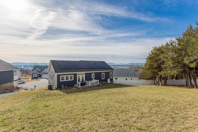 123 Beauregard Dr, Staunton, VA 24401 - rear view of house with solar panels, a deck with mountain view, and a shingled roof