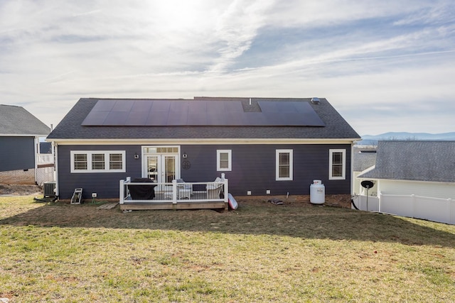 123 Beauregard Dr, Staunton, VA 24401 - back of property featuring a wooden deck, a yard, roof mounted solar panels, roof with shingles, and french doors