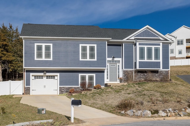 123 Beauregard Dr, Staunton, VA 24401 - view of front of home with a garage, stone siding, and concrete driveway