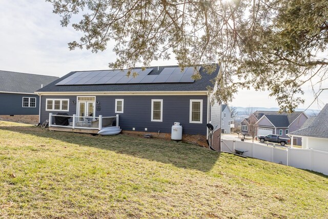123 Beauregard Dr, Staunton, VA 24401 - rear view of house featuring a deck, roof mounted solar panels, a shingled roof, and french doors