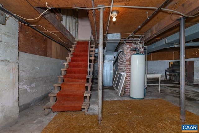 unfinished below grade area with stairway and gas water heater