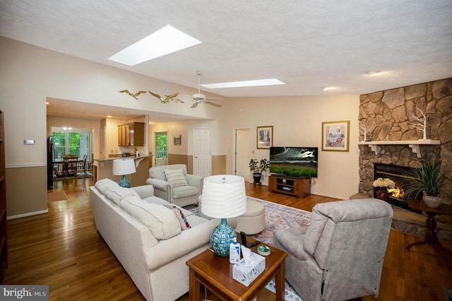 106 Tallwood Trl, Locust Grove, VA 22508 - living area with a skylight, wood finished floors, and a fireplace