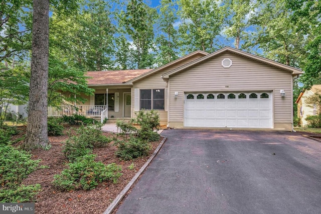 106 Tallwood Trl, Locust Grove, VA 22508 - single story home with asphalt driveway, covered porch, and a garage