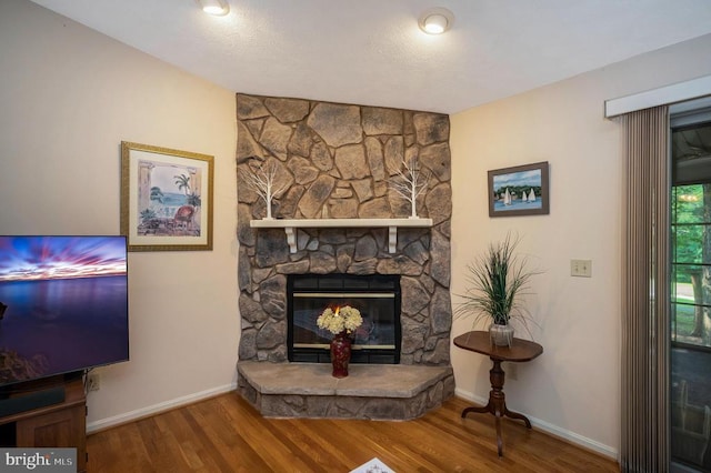 106 Tallwood Trl, Locust Grove, VA 22508 - living area with wood finished floors and a stone fireplace