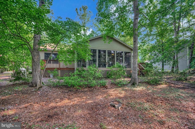 106 Tallwood Trl, Locust Grove, VA 22508 - rear view of house with a sunroom, a deck, and stairway