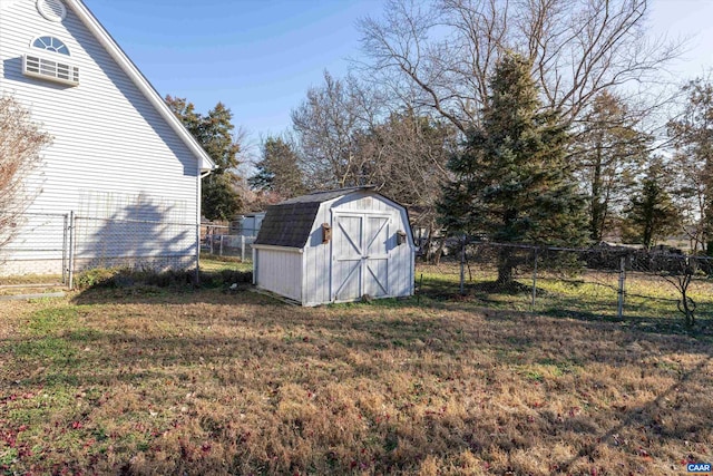 view of shed with a fenced backyard