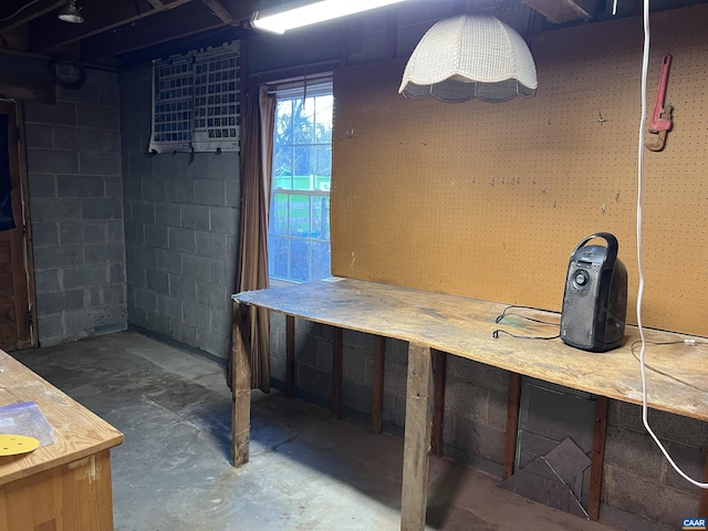 basement featuring concrete block wall