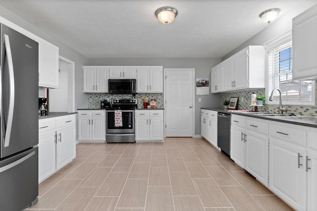 38 Boyington Blvd, Waynesboro, VA 22980 - kitchen with stainless steel appliances, backsplash, and white cabinets