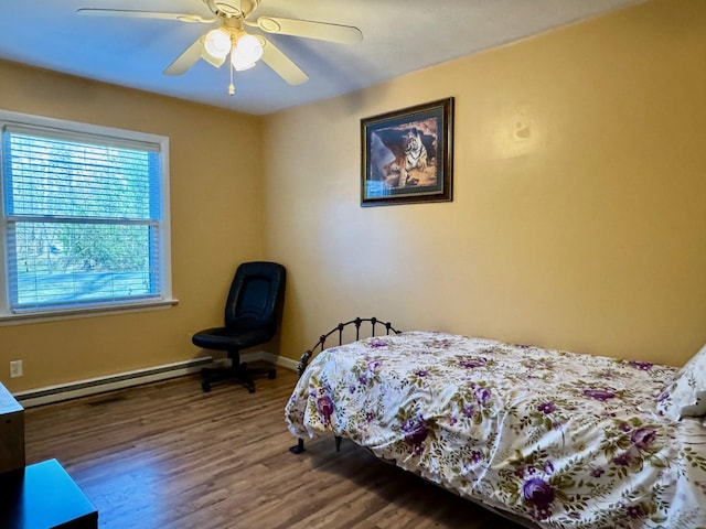8127 Briery Branch Rd, Dayton, VA 22821 - bedroom featuring a baseboard radiator, baseboards, a ceiling fan, and wood finished floors