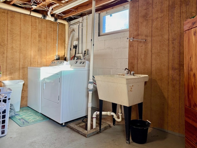 8127 Briery Branch Rd, Dayton, VA 22821 - washroom featuring separate washer and dryer, wooden walls, laundry area, and concrete block wall