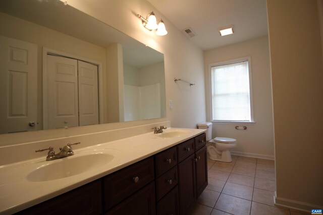 10 Lady Slipper Dr, Waynesboro, VA 22980 - bathroom featuring toilet, double vanity, baseboards, and tile patterned flooring