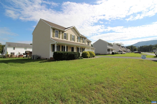 10 Lady Slipper Dr, Waynesboro, VA 22980 - view of front of home featuring central AC, a front yard, a porch, and a mountain view
