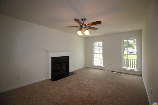 10 Lady Slipper Dr, Waynesboro, VA 22980 - unfurnished living room featuring carpet floors, a ceiling fan, a fireplace with flush hearth, and baseboards